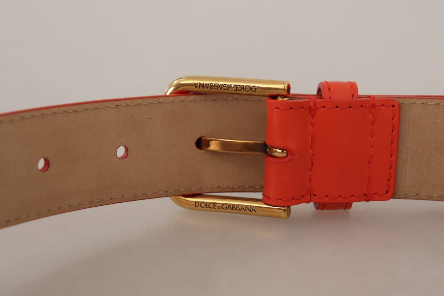Dolce & Gabbana Cinturón elegante de piel naranja con funda para auriculares