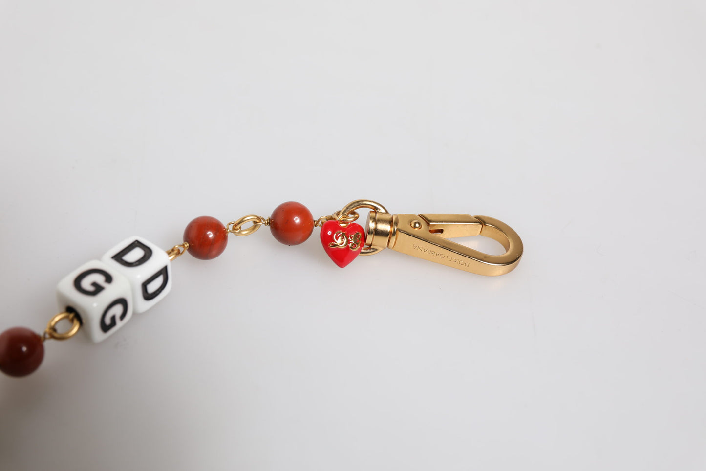 Pulsera Dolce & Gabbana con cadena de latón dorado multicolor y logotipo de DG Dice