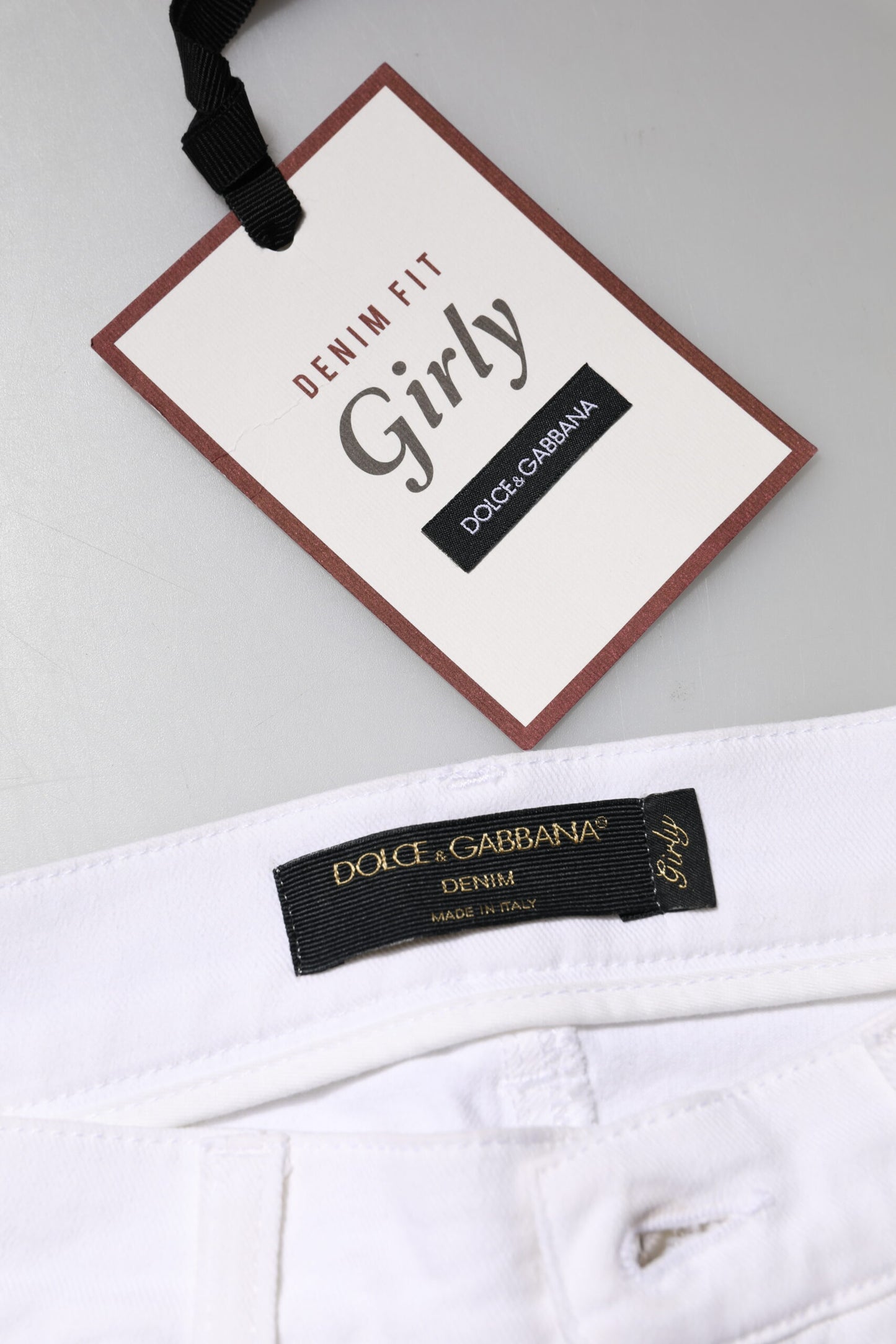 Vaqueros blancos con lentejuelas y estampado floral de Dolce & Gabbana para niñas