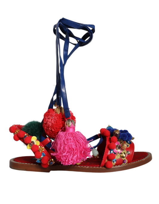 Dolce &amp; Gabbana Sandalias cruzadas de piel con pompones multicolores Zapatos
