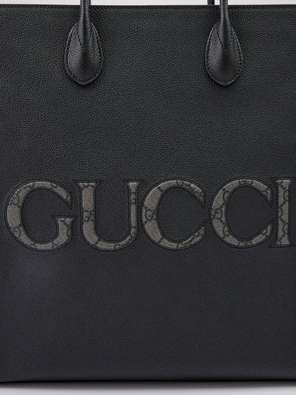 Sac fourre-tout moyen en cuir noir avec logo Gucci