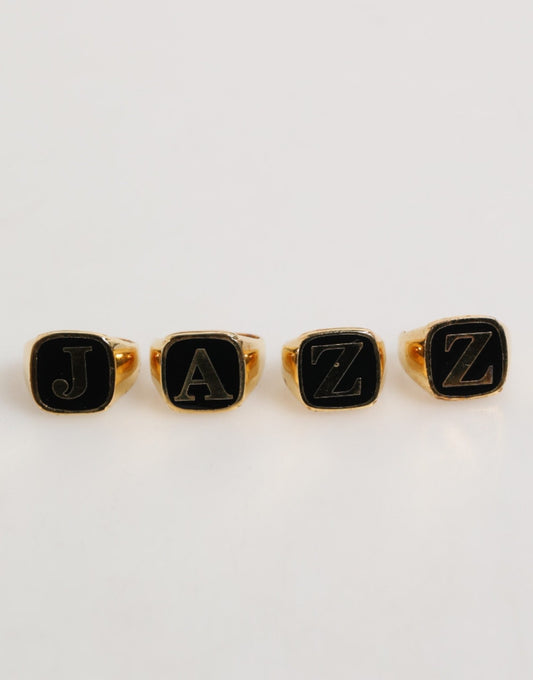 Dolce & Gabbana Gold Tone Brass JAZZ Letter Set 4 Pieces Adjustable Ring – par Dolce & Gabbana | Disponible sur Sandy Store ByNet